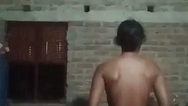 Village girl applying lotion to full nude body