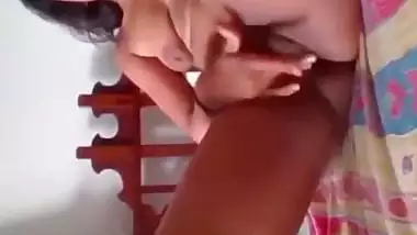 Indian girl playing guitar on pussy